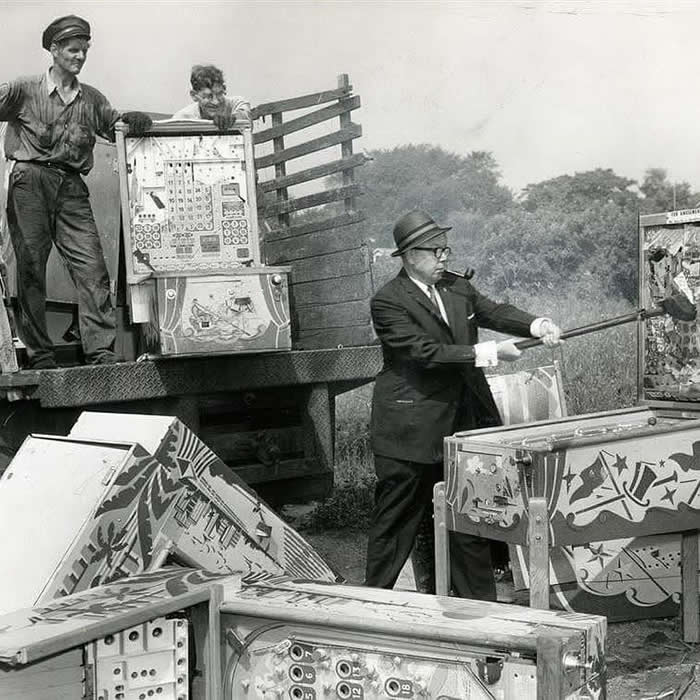 New York police smash ‘gambling devices’ during the city’s pinball ban in 1942.